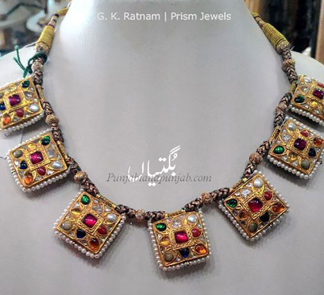   بگتی۔ بگتیاں. ,bugti,bugtiyaaN,ਬੁਗਤੀ,ਬੁਗਤੀਆਂ,بتکی,مہاراجہ رنجیت سنگھ کے وقت کا ایک سکہ جس کی قیمت پانچ روپے کے قریب بنتی تھی, ان سکوں کا بنا ہوا گلے کا ایک ہار۔
  بگتیاں,   گلے میں ڈالنے والا ایک نکلیس کی طرح کا ایک زیور جو سکوں کا بنا ہوتا ہے,
سکوں، سونے یا چاندی کے سکوں یا تعویذوں کا ہار، زیور کی ایک قسم,  A gold coin current during Sikh rule in the Punjab; necklace made with such coins or gold discs. buggti.Traditional Ornaments of Punjab,Jewellery,jewelry,zaiwar,زیور, ,گہنا,بُھوکھن,النکار,ٹُوم,ٹومب,ٹونب چھلا 
